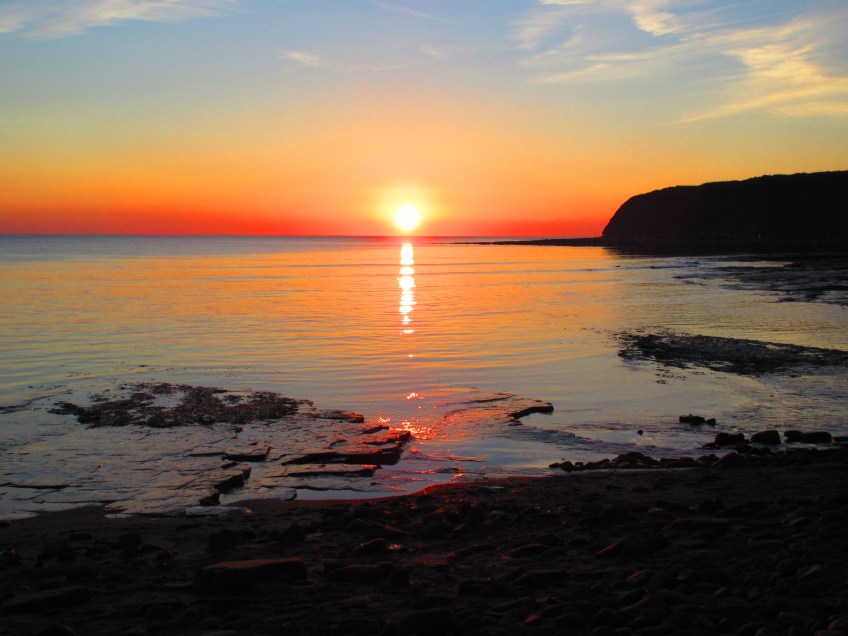 Photo of bright red sunset at Kimmeridge in Dorset